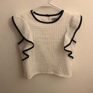 White blouse with black ruffle trim